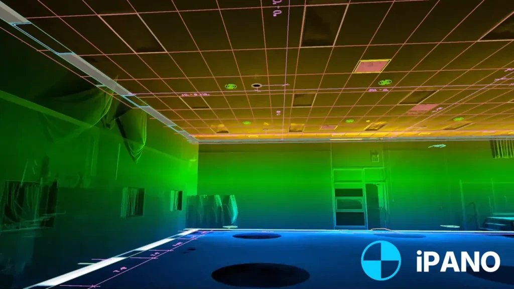 Colorized LiDAR point cloud scan of a commercial interior with ceiling grid linework